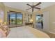 Bedroom with king-size bed and sliding doors to a patio at 13384 Creekside Ln, Port Charlotte, FL 33953