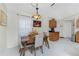 Bright dining area with a wooden table, fall decor, and curtains at 13515 Keystone Blvd, Port Charlotte, FL 33981