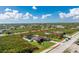 Bird's-eye view of a house with a fenced backyard and pool at 13515 Keystone Blvd, Port Charlotte, FL 33981