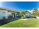 Well-maintained house with a charming front porch at 13515 Keystone Blvd, Port Charlotte, FL 33981