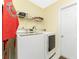 Laundry room with washer, dryer, and overhead shelving at 13515 Keystone Blvd, Port Charlotte, FL 33981