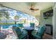 Relaxing pool area with seating and a screened enclosure at 13515 Keystone Blvd, Port Charlotte, FL 33981
