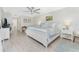 Main bedroom with king-size bed and light wood floors at 13515 Keystone Blvd, Port Charlotte, FL 33981