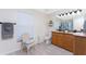 Bathroom with double vanity, wood cabinets, and a shower at 13515 Keystone Blvd, Port Charlotte, FL 33981