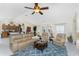Open concept living room with comfortable seating and kitchen view at 13515 Keystone Blvd, Port Charlotte, FL 33981