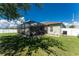 Spacious backyard with pool and screened enclosure at 13515 Keystone Blvd, Port Charlotte, FL 33981