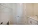 Laundry room with utility sink, built-in shelving, and white cabinets at 14304 Amestoy Ave, Port Charlotte, FL 33981