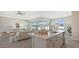 Open concept kitchen and living room with kitchen island and seating at 14304 Amestoy Ave, Port Charlotte, FL 33981