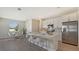 Modern kitchen with white cabinets and quartz countertops at 14304 Amestoy Ave, Port Charlotte, FL 33981