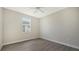 Spacious bedroom with ceiling fan and wood-look flooring at 14304 Amestoy Ave, Port Charlotte, FL 33981