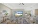 Open concept living room showcasing sliding glass doors and backyard access at 14304 Amestoy Ave, Port Charlotte, FL 33981