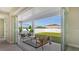 Covered patio with lounge seating and lush green lawn at 14304 Amestoy Ave, Port Charlotte, FL 33981