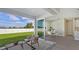 Covered patio with seating area and view of backyard at 14304 Amestoy Ave, Port Charlotte, FL 33981