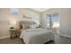 Bedroom with a queen bed, nightstands, and sliding glass doors to backyard at 14304 Amestoy Ave, Port Charlotte, FL 33981