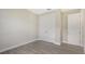 Bright bedroom with double door closet and wood-look flooring at 14304 Amestoy Ave, Port Charlotte, FL 33981