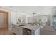 Open concept kitchen with island, stainless steel appliances, and white cabinets at 14304 Amestoy Ave, Port Charlotte, FL 33981