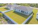 Aerial view of house with fenced backyard and surrounding homes at 14304 Amestoy Ave, Port Charlotte, FL 33981