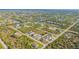Aerial view highlighting a new three-unit home development at 14304 Amestoy Ave, Port Charlotte, FL 33981