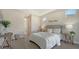Bedroom with queen-size bed, two nightstands, and access to a bathroom at 14304 Amestoy Ave, Port Charlotte, FL 33981