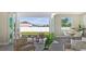 Bright living room with sliding glass doors leading to a patio and backyard at 14304 Amestoy Ave, Port Charlotte, FL 33981