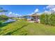 Backyard view of homes along a canal at 14439 Worthwhile Rd, Port Charlotte, FL 33953