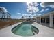 Relaxing kidney-shaped pool with patio, ideal for entertaining at 1451 Deer Creek Dr, Englewood, FL 34223