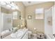 Clean bathroom with single vanity, bathtub, and shower at 1985 Coconut Palm Cir, North Port, FL 34288