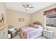Guest bedroom with queen bed and built-in shelving at 1985 Coconut Palm Cir, North Port, FL 34288