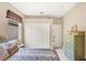Guest bedroom with queen bed and ample closet space at 1985 Coconut Palm Cir, North Port, FL 34288