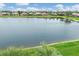 Stunning aerial view showcasing a tranquil lake and waterfront homes at 1985 Coconut Palm Cir, North Port, FL 34288