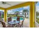 Covered patio area with pool, lake view, and seating at 1985 Coconut Palm Cir, North Port, FL 34288