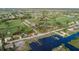 Aerial view of a waterfront community with golf course at 268 Rotonda W Blvd # 1B, Rotonda West, FL 33947