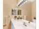 Bathroom boasts double sinks, stylish lighting, and plenty of counter space at 268 Rotonda W Blvd # 1B, Rotonda West, FL 33947
