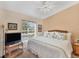King sized bed with wicker furniture and a TV at 268 Rotonda W Blvd # 1B, Rotonda West, FL 33947