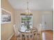 Charming dining area with table and chairs near kitchen at 268 Rotonda W Blvd # 1B, Rotonda West, FL 33947