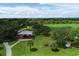 Community playground with shaded play structure and walking path at 268 Rotonda W Blvd # 1B, Rotonda West, FL 33947
