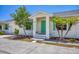 Charming home exterior with a teal front door at 268 Rotonda W Blvd # 1B, Rotonda West, FL 33947