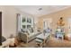 Bright living room featuring comfortable seating and a cozy atmosphere at 268 Rotonda W Blvd # 1B, Rotonda West, FL 33947