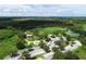 Aerial view of community park with playground, tennis courts, and open green space at 268 Rotonda W Blvd # 1B, Rotonda West, FL 33947