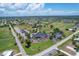 Aerial view of country club with parking and golf course at 268 Rotonda W Blvd # 1B, Rotonda West, FL 33947