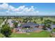 Aerial view of country club with parking and golf course at 268 Rotonda W Blvd # 1B, Rotonda West, FL 33947