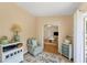 Open living room with wood floors and access to a home office at 268 Rotonda W Blvd # 1B, Rotonda West, FL 33947