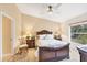 Spacious bedroom with a ceiling fan, carpeted floors, and lots of natural light at 268 Rotonda W Blvd # 1B, Rotonda West, FL 33947