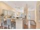 Kitchen boasts updated cabinetry and breakfast bar at 268 Rotonda W Blvd # 1B, Rotonda West, FL 33947