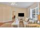 Living room with large TV, comfy seating, and natural light at 268 Rotonda W Blvd # 1B, Rotonda West, FL 33947