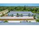 Aerial view of a four-unit building complex with parking at 268 Rotonda W Blvd # 1B, Rotonda West, FL 33947