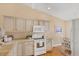 Clean and bright kitchen, offering ample storage at 268 Rotonda W Blvd # 1B, Rotonda West, FL 33947