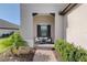 Inviting front porch with seating area, perfect for relaxing outdoors at 27467 Janzen Ct, Englewood, FL 34223