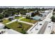 Aerial view of a city park with lush green grass and well-maintained sidewalks at 42 Caroll Cir, Englewood, FL 34223