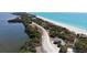 Roadside view of beach access and small building at 42 Caroll Cir, Englewood, FL 34223